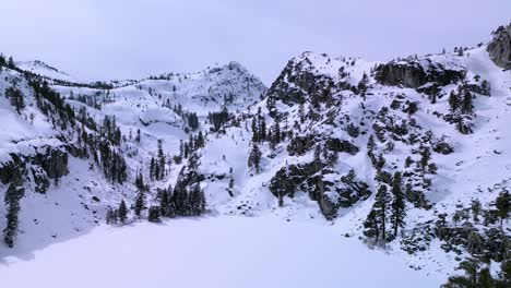 Aerial-view-of-Eagle-Lake-mountains-with-snow-landscape,-Lake-Tahoe,-Desolation-Wilderness