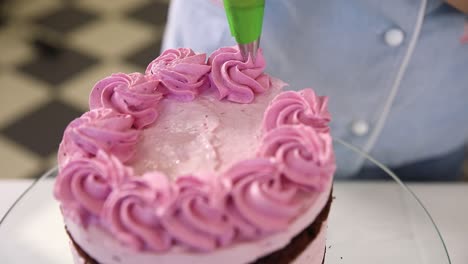 pink layer cake decorating process