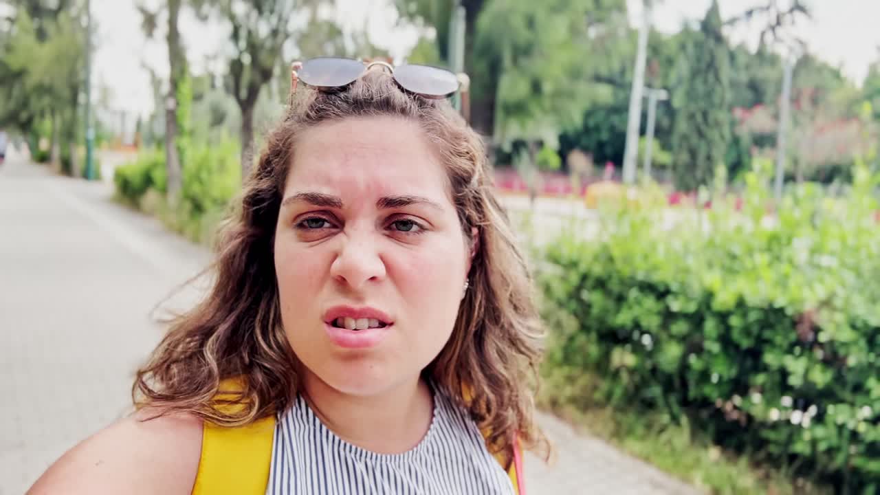 Confident Young Woman Looking Directly at the Camera Outdoors in Athens