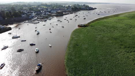 beautiful aerial shot of moored boats at topsham on the river exe on a sunny morning