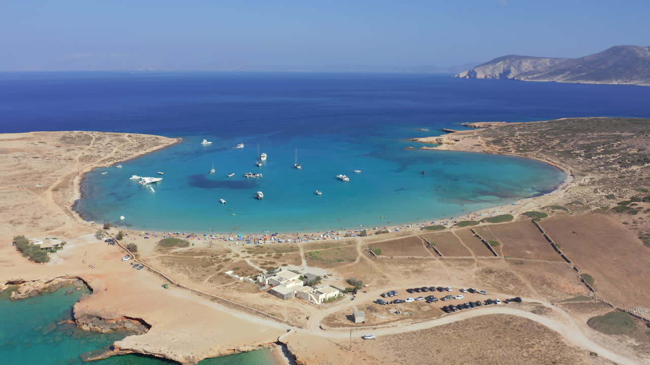 Drone passes above Pori Beach and calm shoreline of Koufonisia, Cyclades Islands, Greece