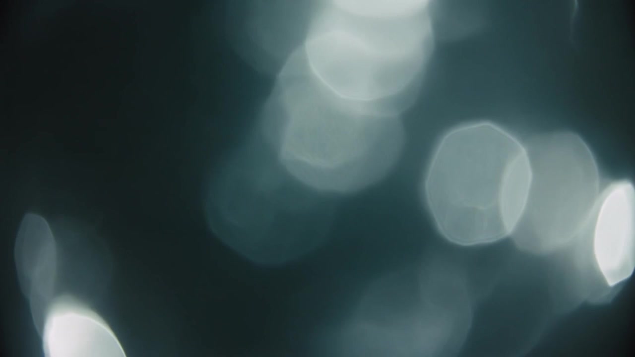 Sfondo Astratto con Sfere di Luce Bokeh Bianche e Soffuse