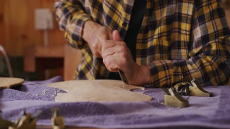 female luthier at work in her workshop