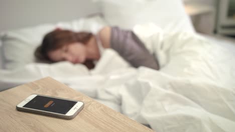 Mobile-alarm-wake-up-woman-in-bed.-Wake-up-time-in-morning.-Female-new-day