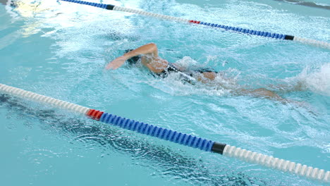 swimmer in action at a pool competition