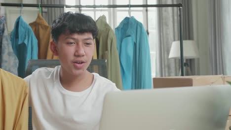 Teenager Reviewing Clothes Online