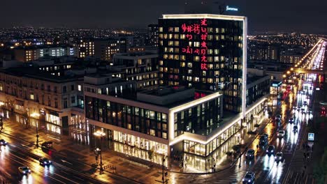 wet asphalt reflecting vibrant city lights, illuminating sleek urban architecture with glowing japanese characters, cars moving through nighttime downtown streetscape