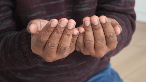 close-up of a person's hands in prayer