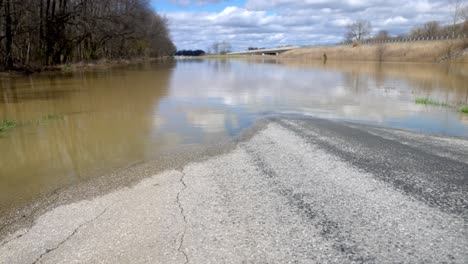 rural southern indiana flood damage with gimbal video walking forward low.