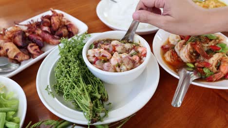 hands mixing ingredients for a healthy salad