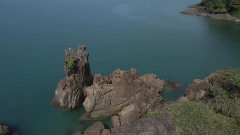 Aerial-top-view-tropical-ocean-granite-rock-formation-coastline-turquoise-water