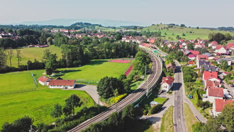 southern germany in stunning aerial footage capturing a tranquil village with train tracks