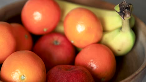 hand taking out fresh apple from fruits bowl and returning it back, nested sequence