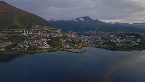 establishing aerial shot of narvik on coastline in nordland, norway