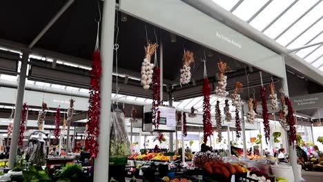 garlic hanging in vegetable store, bolhao market, porto