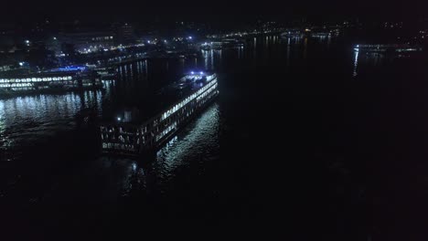 4k-video-of-a-big-launch-moving-on-a-river-at-night