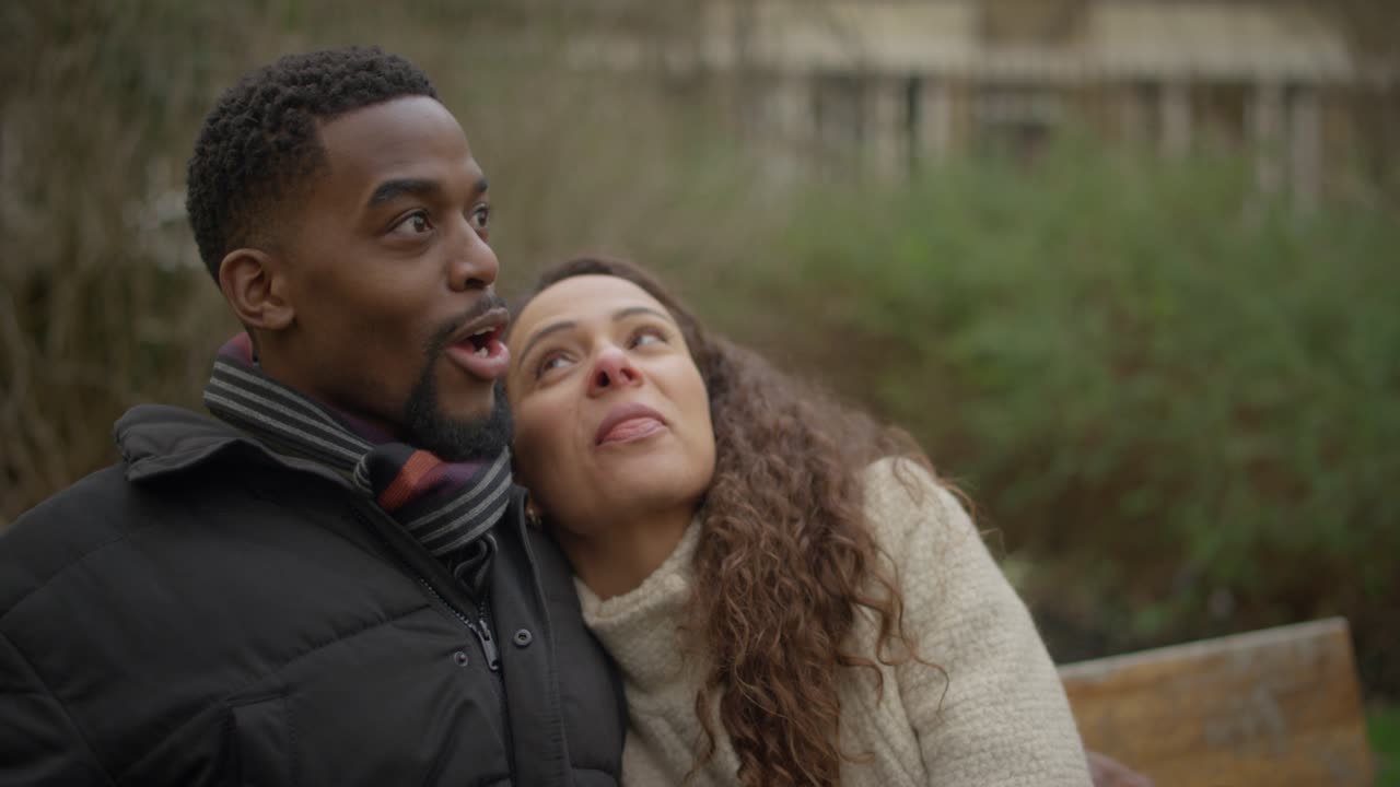 Couple Talking on Park Bench