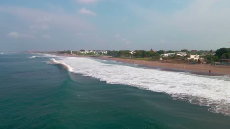 closeup scene of waves perfect for surfing at beautiful berawa beach in canggu, bali indonesia