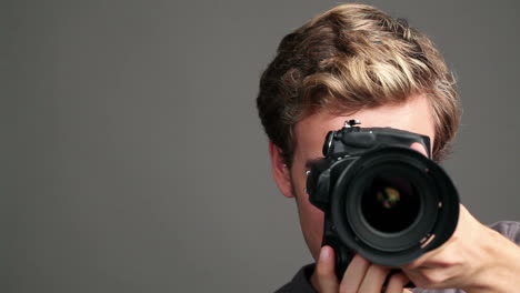 young man demonstrating photography techniques