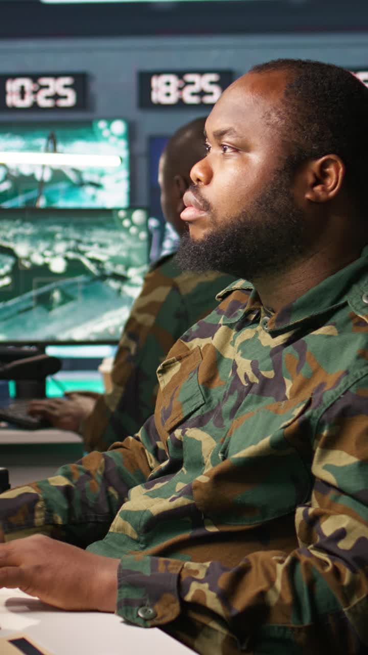 Vertical video Officer doing tasks in military base, analyzing moves