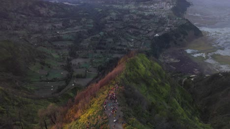 aerial footage of tourists viewing the mount bromo sunrise from one of the many lookout points