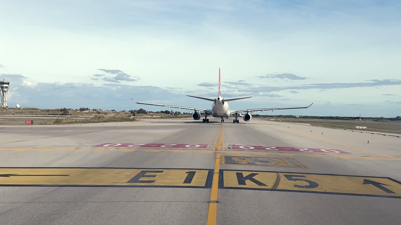 An immersive cockpit view of a massive wide-body twin-engine jet taxiing to the runway for takeoff. Handheld camera shot