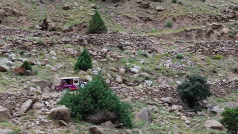 tracking follows jeep climbing and bouncing across the the steep fairy meadows road, world's most treacherous paths traversing mountains and ridges