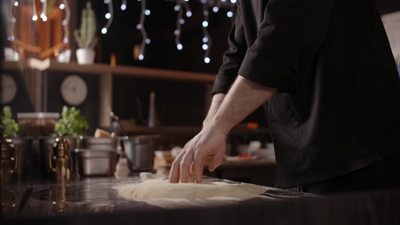 Chef Kneading and Shaping Pizza Dough