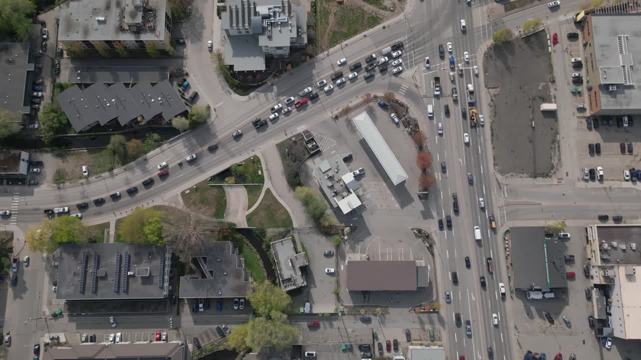 Drone rising above busy traffic intersection