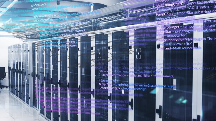 Animation of multicolored computer language over data server racks in server room