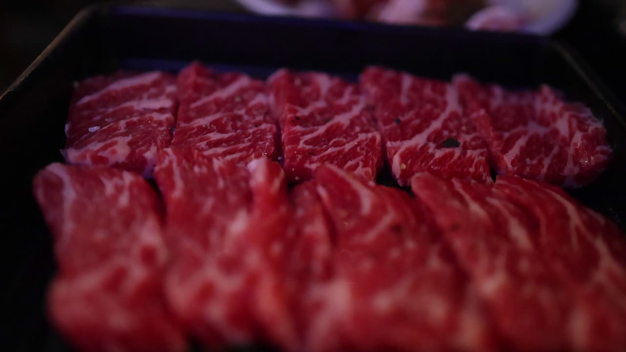 Beef slices being grilled in a restaurant