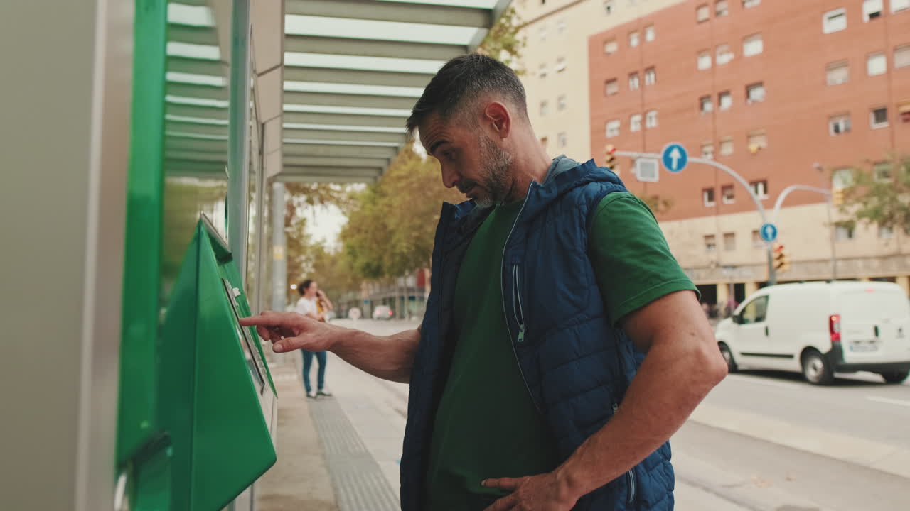 Man using a public transportation machine in the city