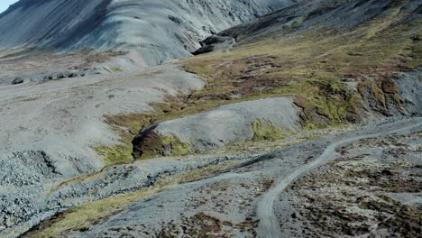 Hostile-and-scenic-volcanic-landscape-of-Iceland---aerial-tilt-up-view