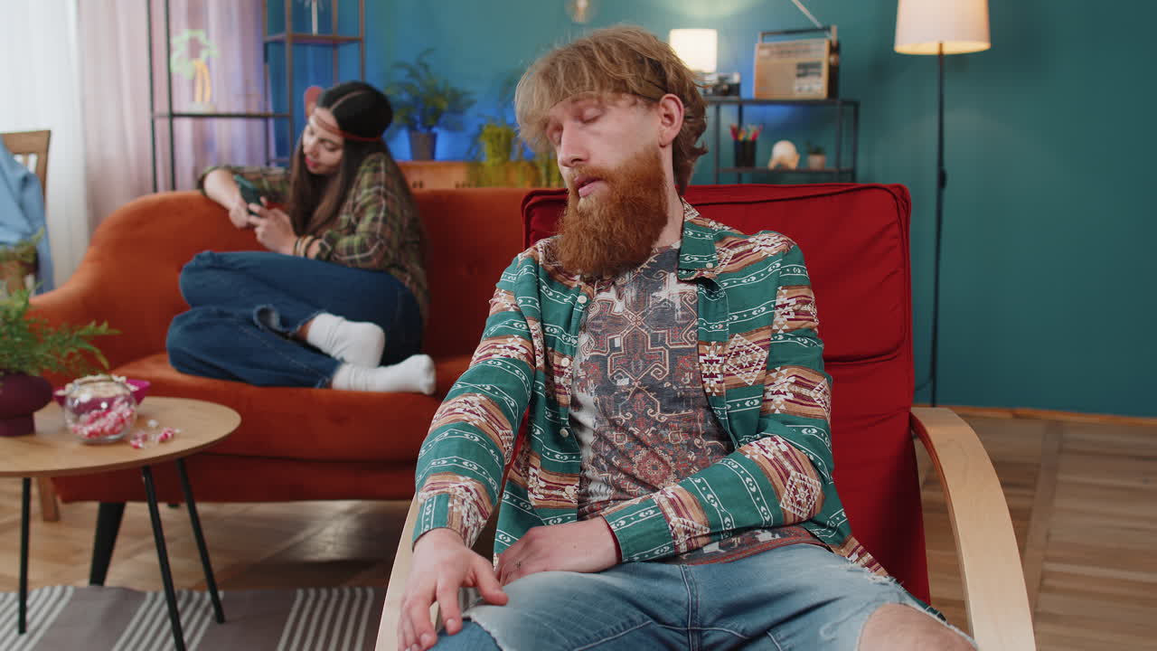 Unhappy man quarreling with woman addicted on online shopping wasting money credit card smartphone