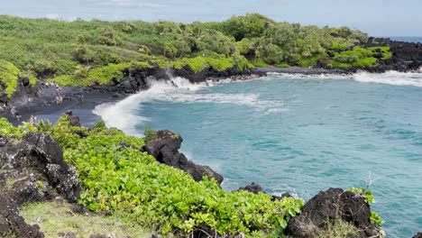 A-scenic,-picturesque-view-of-a-Hawaiian-black-sand-beach-coastline