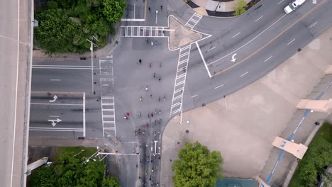 group of bicycle riders in atlanta, georgia riding on street with drone overhead view