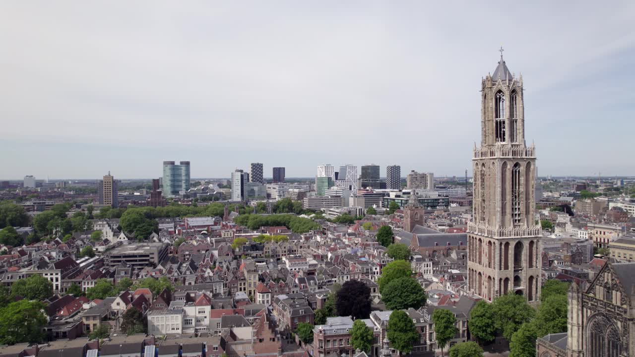 Aerial reveal of church and gothic architecture of the Utrecht diocese ambulatory and transept. Holland religious tourist destination seen from above.