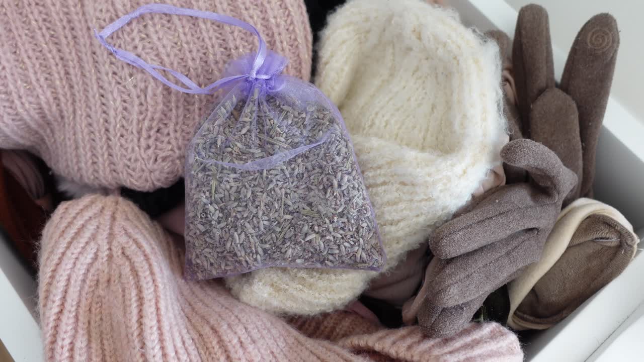Lavender sachet with winter clothing