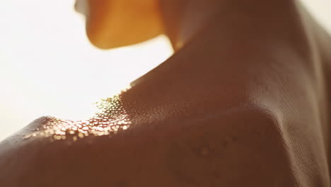 golden light on moist skin
