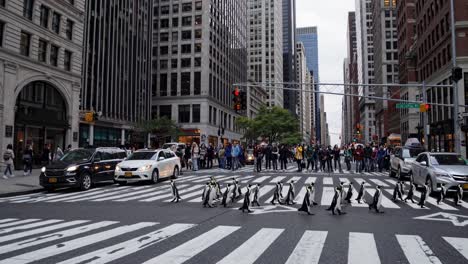 penguins crossing a new york city street