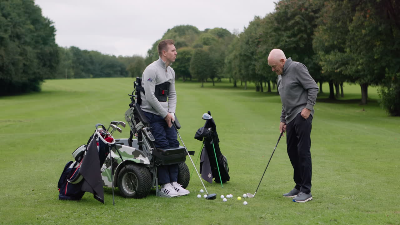 People golfing on a golf course