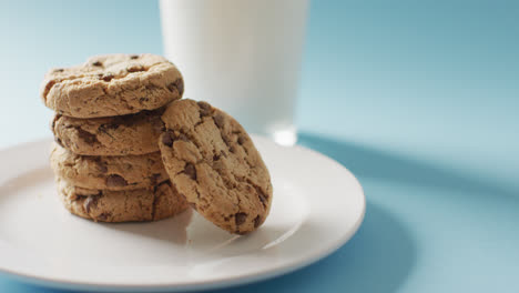 Video-of-biscuits-with-chocolate-and-milk-on-blue-background