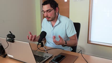 young man teaching online class