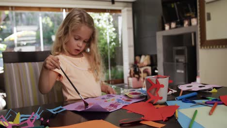 mother and daughters painting together