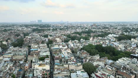 4k aerial shots of new delhi residential suburbs on a beautiful day gliding over rooftops, streets, parks and markets in india