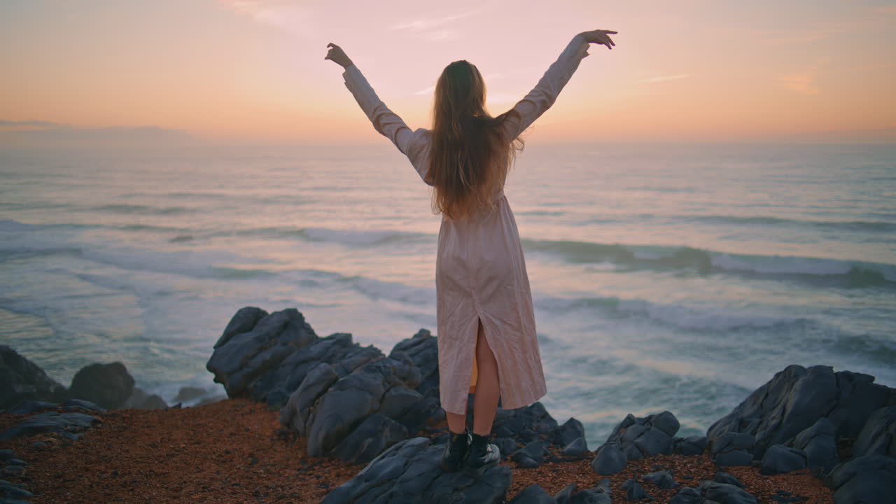 Dress lady watching evening marine nature back view. Woman touching hairstyle