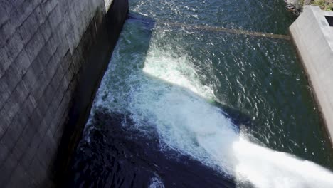 water-pump-from-a-barrage,-pumping-water-into-river