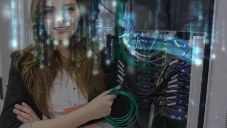 Animation-of-lights-falling-over-happy-caucasian-woman-with-wires-standing-at-servers