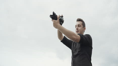 man taking a photo outdoors