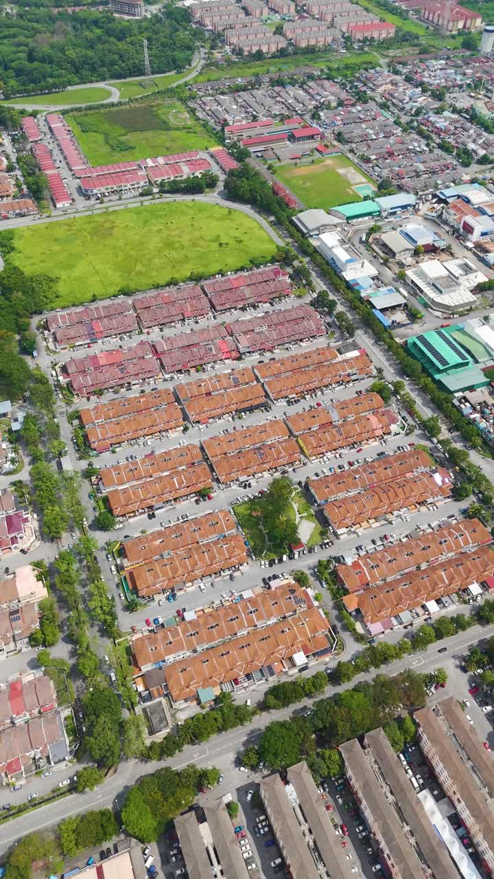 Vertical aerial shot of the Royal City of Klang housing area during the day in the state of Selangor, Malaysia
